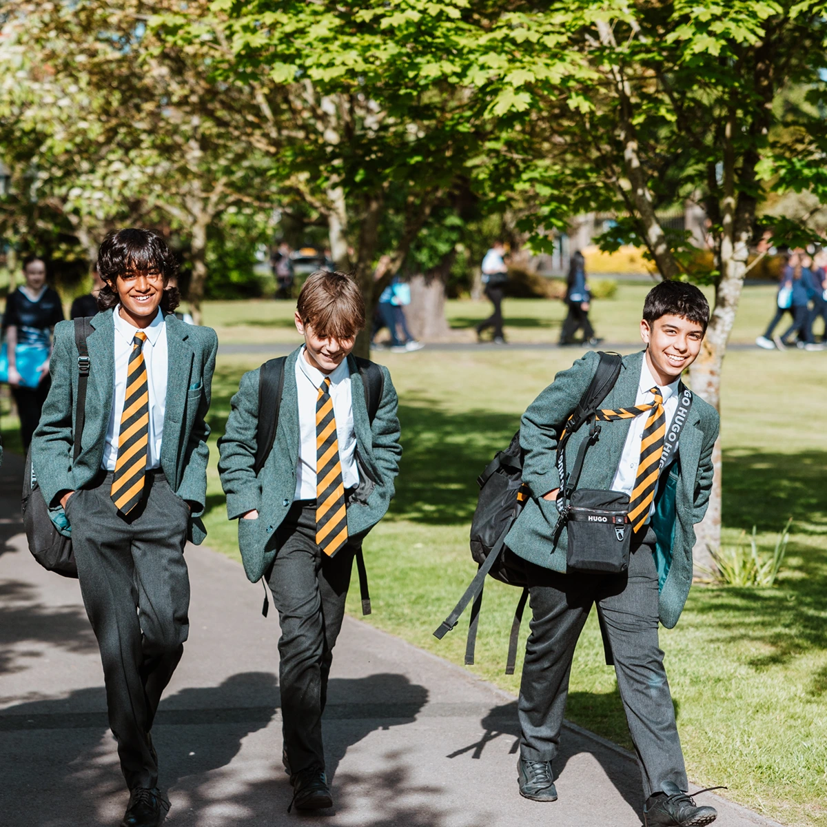boys arriving at school in uniform